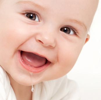 Close up of an adorable baby drooling, on white background